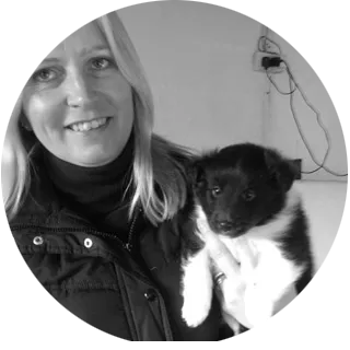 Sally Hubbard holding a puppy